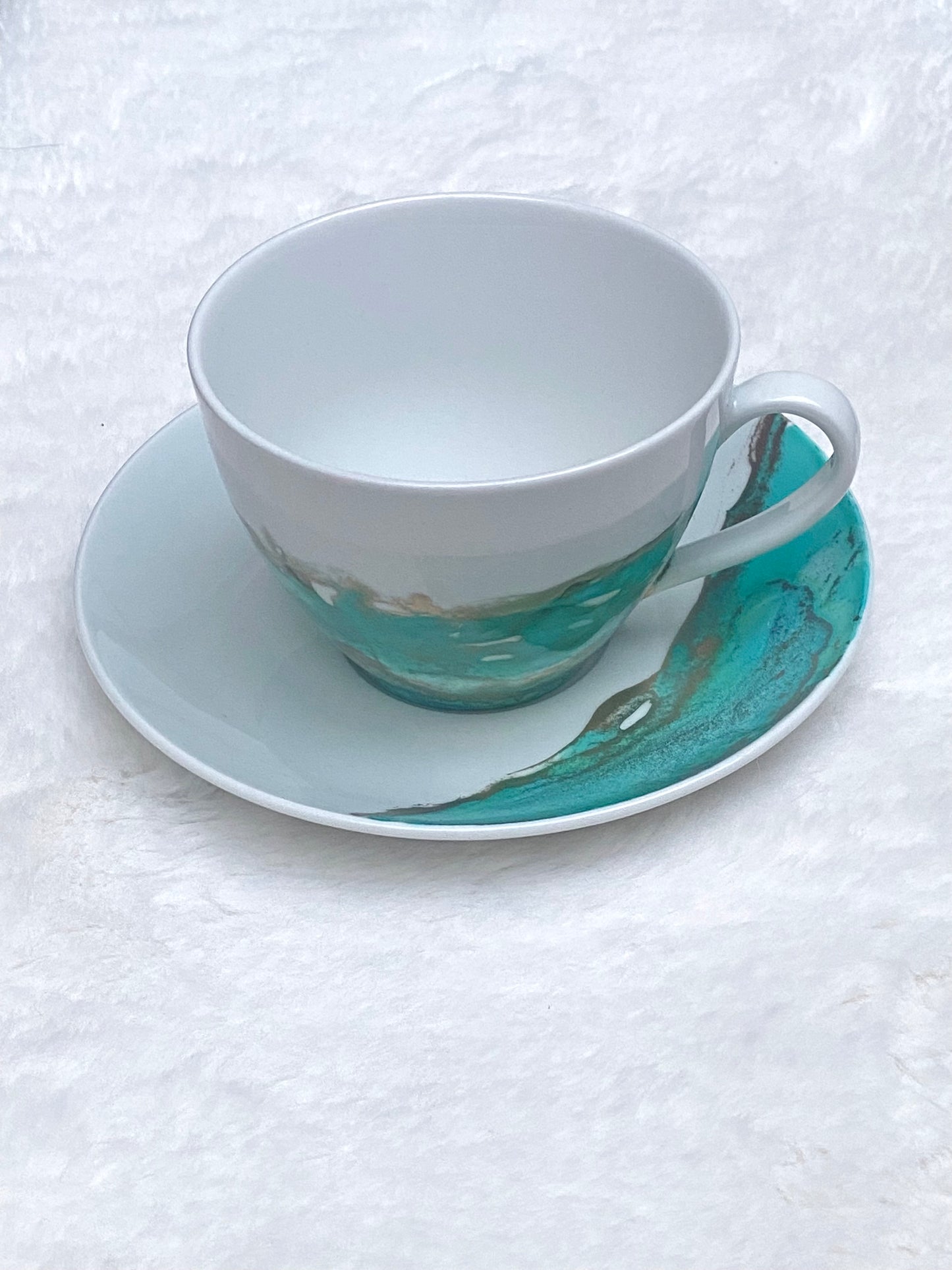 Hand-Painted White Porcelain Teacup and Saucer